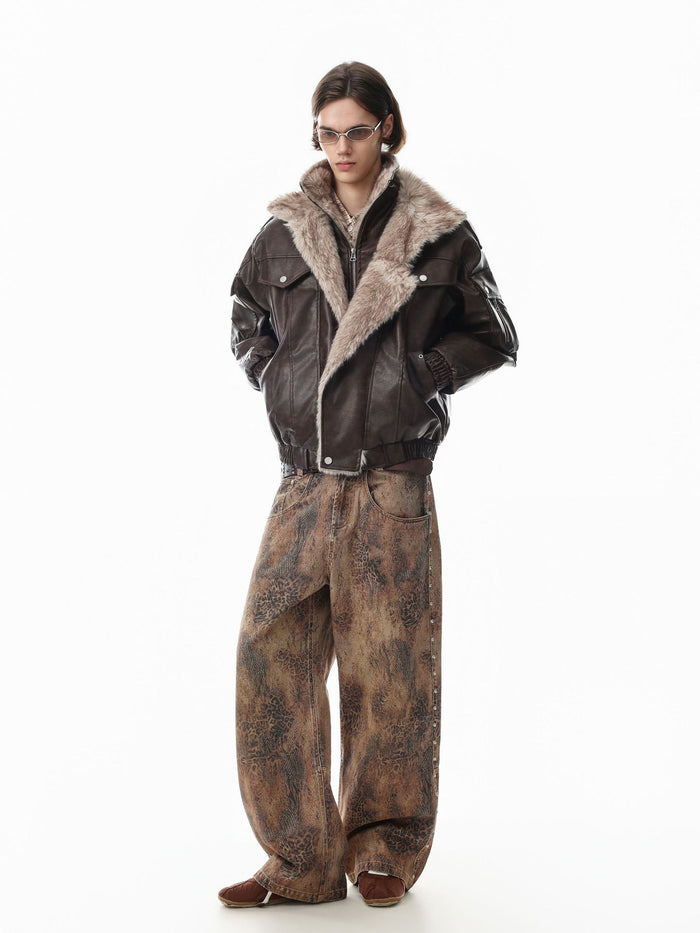 Full-body view of a model wearing a brown faux leather bomber jacket with cream fur trim and loose trousers