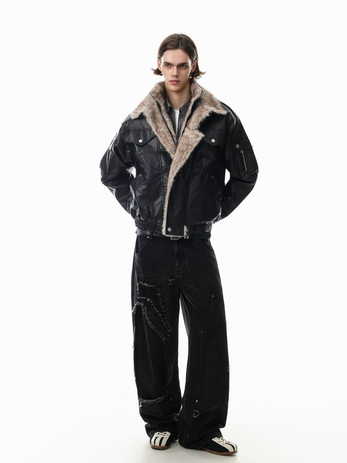 Full-body view of a model wearing a black faux leather bomber jacket with a cream fur collar and black trousers