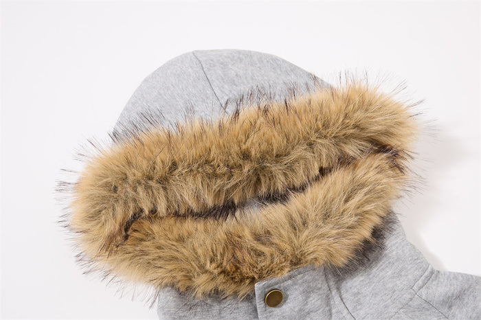 Close-up of the gray hoodie's tan fur trim showing the soft textured edging around the hood