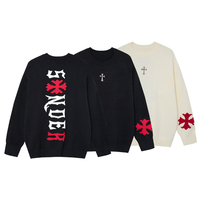 Three oversized knit crewneck sweaters in black and cream with cross and red graphic details