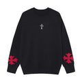 Oversized men's gothic cross jacquard crewneck knit sweater in black showing front cross badge and red sleeve panels