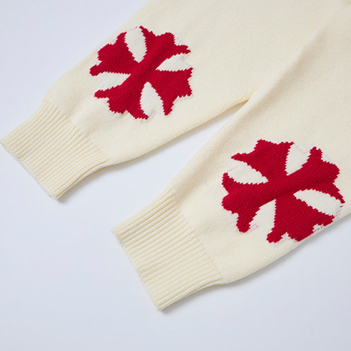 Cream sweater sleeves with red graphic motifs and ribbed knit cuffs