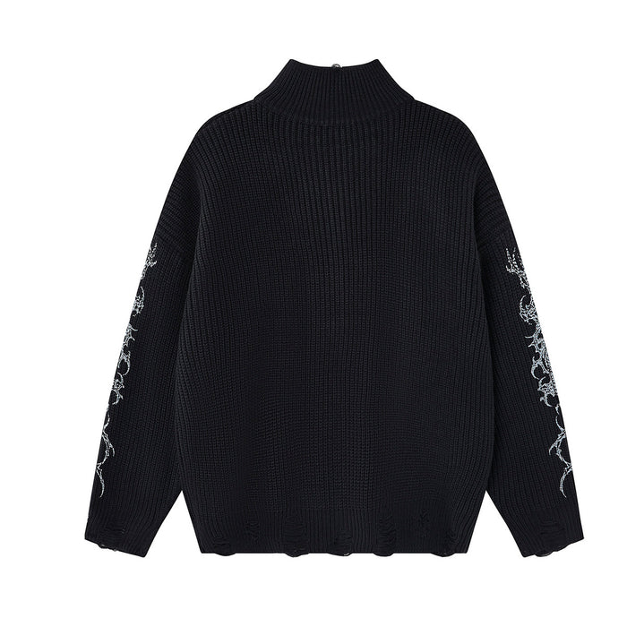 Black knit zip-up turtleneck sweater shown from the back with white graphics visible along both sleeves
