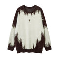 Front view of an oversized fuzzy knit sweater in cream and dark brown with a jagged pattern and chest emblem
