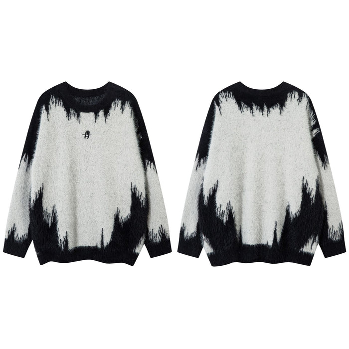 White and black fuzzy knit sweater shown in front and back views with a contrasting jagged pattern