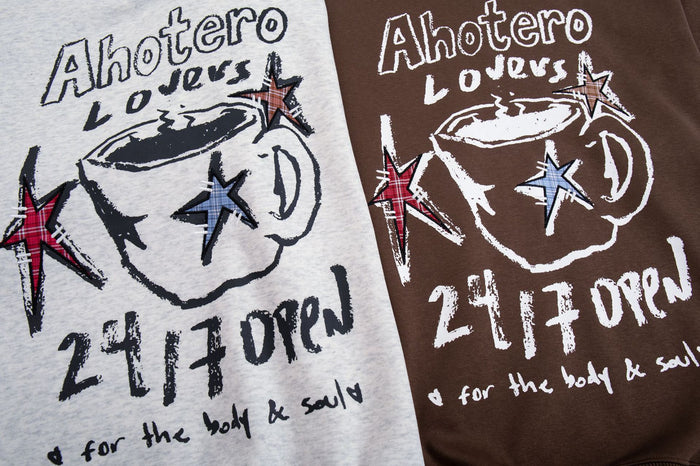 Close-up comparison of light gray and brown hoodie chest graphics with coffee cups, stars, and lettering