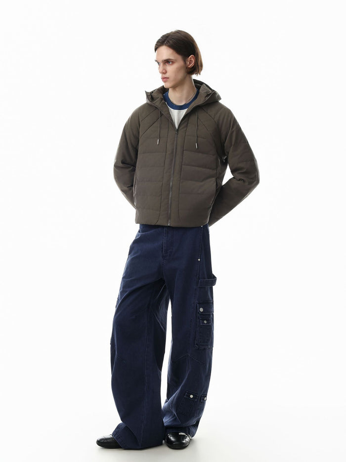 Olive-gray hooded quilted puffer jacket worn in a three-quarter front view