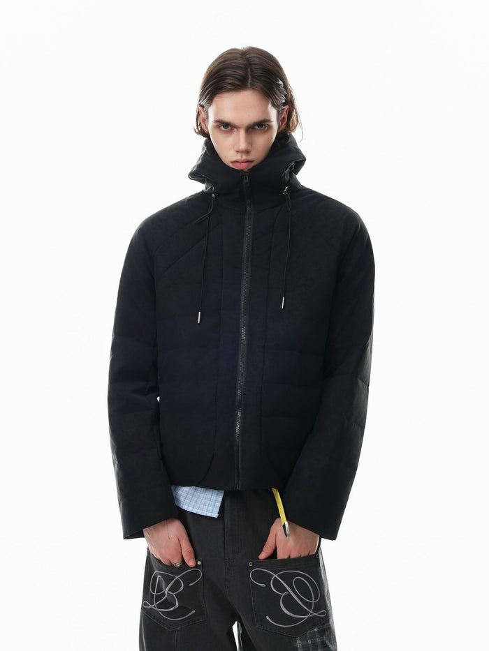 Black hooded quilted puffer jacket worn zipped in a straight-on front view