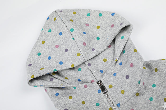 Close-up of the grey polka dot hoodie showing the hood, front zipper, and surrounding seam details
