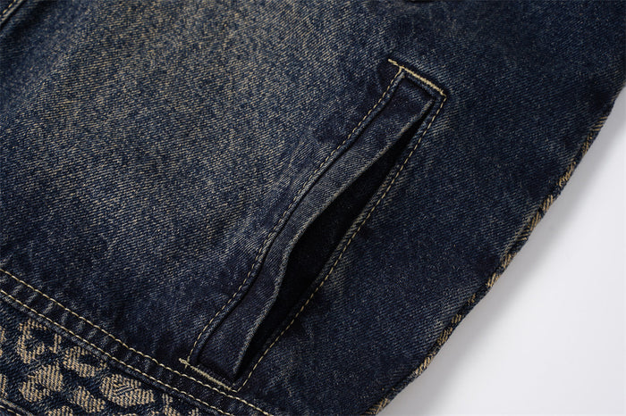 Close-up of a dark washed denim side welt pocket with tan stitching and leopard-patterned trim