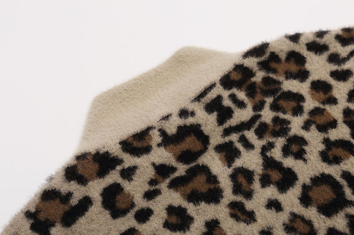 Close-up of the jacket shoulder showing the soft beige ribbed collar beside leopard print fabric
