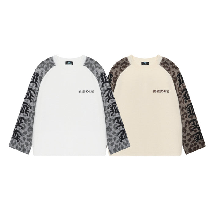 Two raglan knit sweaters in white and cream, each with brown or gray leopard-print sleeves
