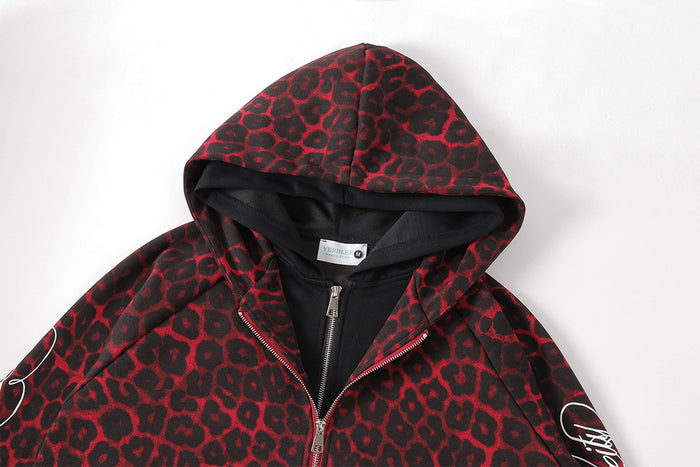 Close-up of the leopard-print hood, black lining, collar, and upper zipper on a red and black jacket