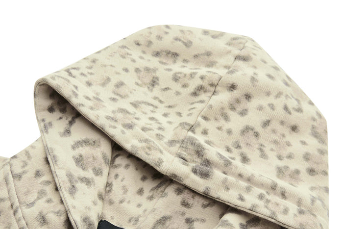 Close-up of the beige leopard-print hood showing its stitched panel construction and patterned fabric