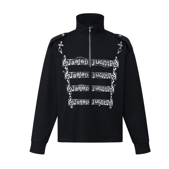 Front view of a black stand-collar half-zip shirt with white musical score graphics and shoulder hardware