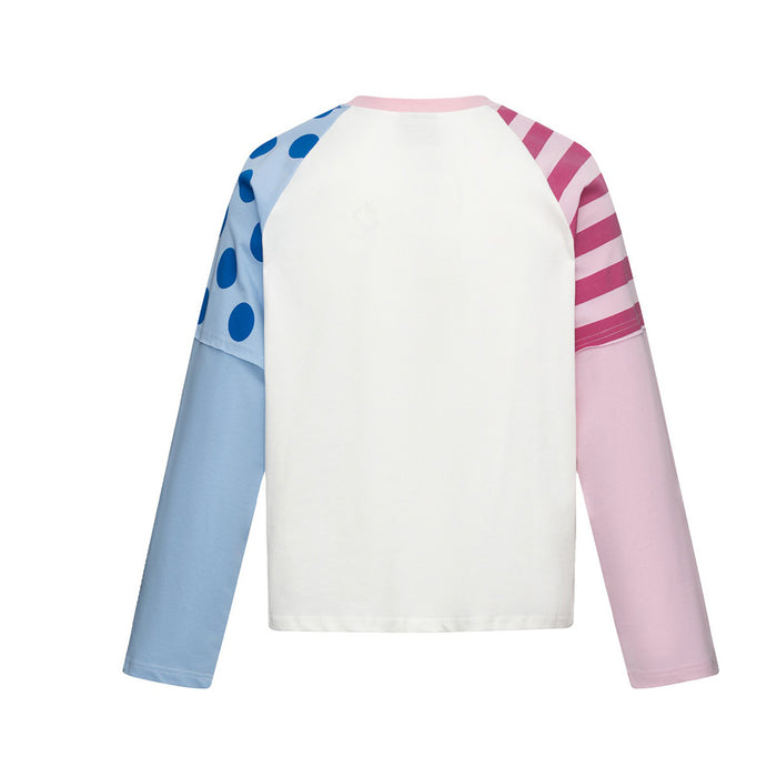 Back view of a white raglan baby tee with pale blue polka dot and pink striped sleeves