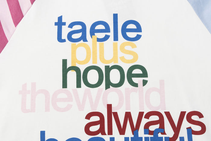 Close-up of the colorful front text graphic reading taele plus hope theworld always beautiful