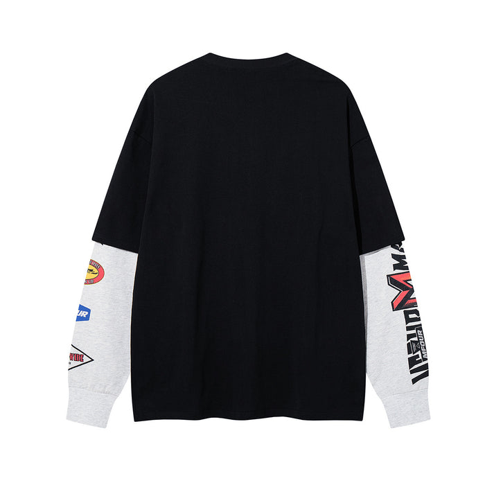 Back view of black faux-layered long sleeve shirt with contrasting gray graphic sleeves