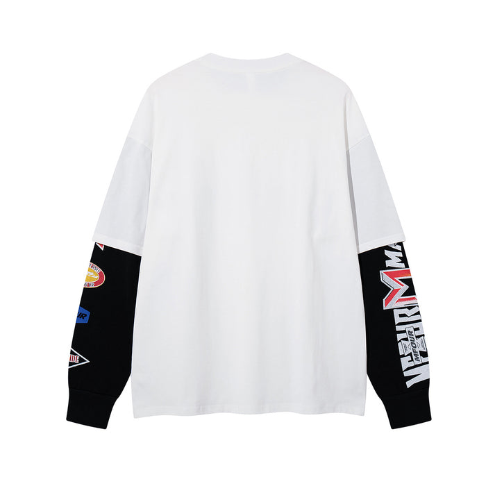 Back view of white long sleeve shirt with black graphic sleeves and contrasting patches