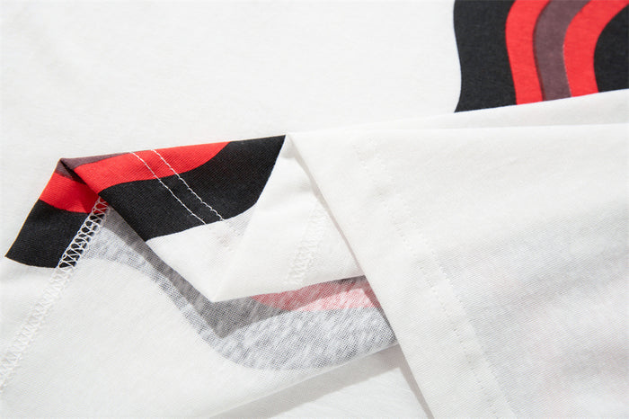Close-up of the jersey tee interior collar seam showing stitching and a black-red stripe detail