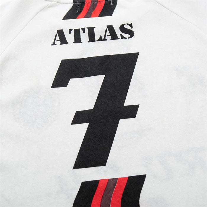 Back detail of the white jersey tee showing ATLAS, oversized black number 7, and black-red wavy stripes
