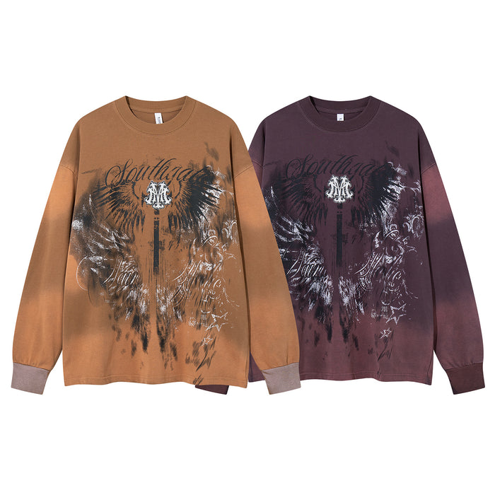 Two oversized long sleeve graphic shirts in tan and deep plum with winged eagle prints and script lettering