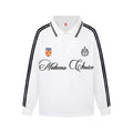 White long sleeve polo shirt with black striped sleeves, striped collar, crest patches, and script chest logo