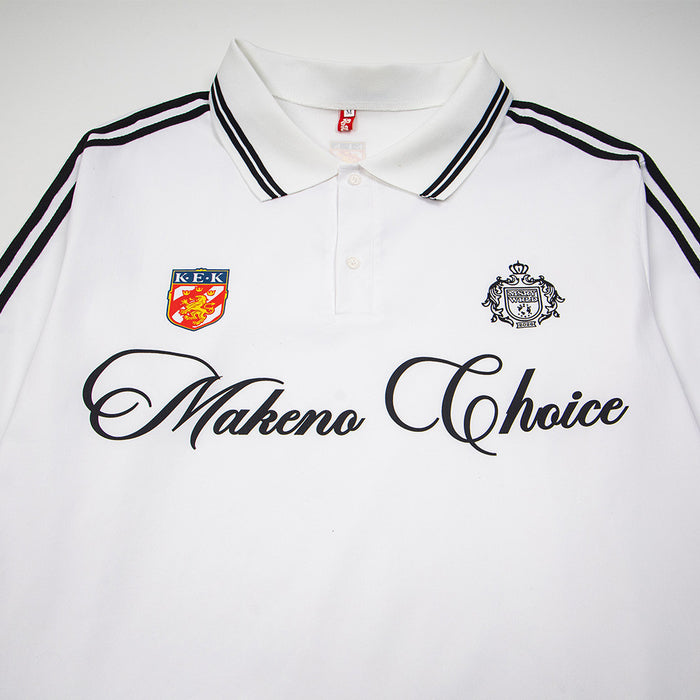 Close-up of white polo shirt front showing striped collar, two crest patches, buttons, and script chest logo