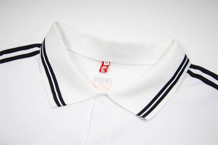 Close-up of white polo shirt collar with black double stripes and red neck label