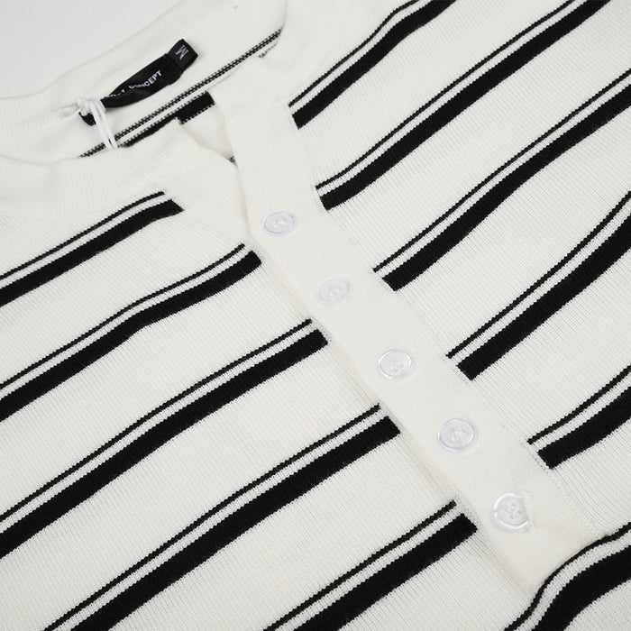 Detailed view of the white knit henley placket showing five buttons and horizontal black stripes