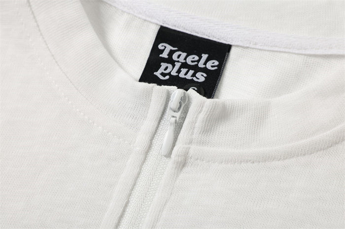 Detailed view of the white shirt collar, front zipper pull, stitching, and black neck label