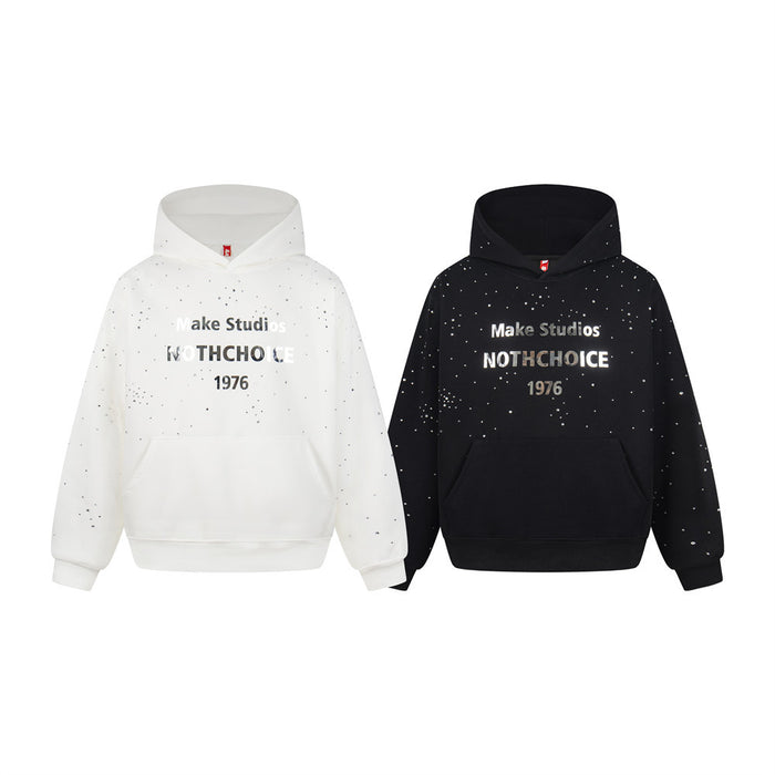 Front view of white and black oversized pullover hoodies with rhinestone splatter and 1976 chest lettering