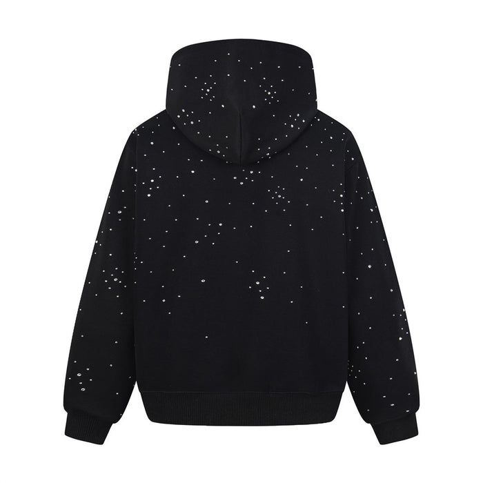 Back view of a black oversized pullover hoodie covered with scattered rhinestone embellishments