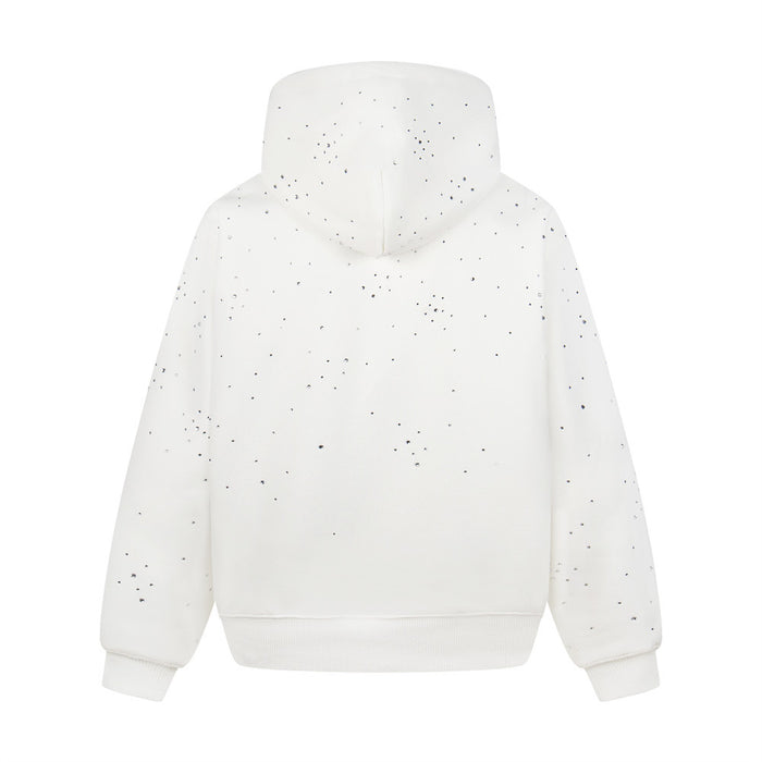 Back view of a white oversized pullover hoodie with scattered rhinestone embellishments on the hood and sleeves