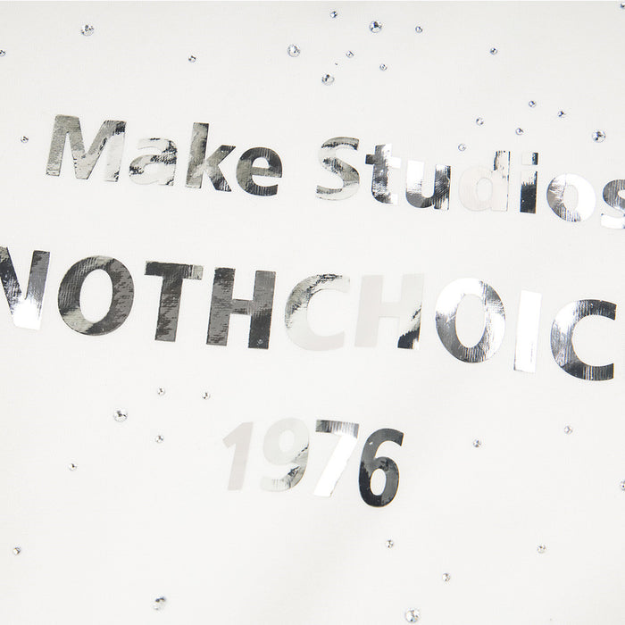 Close-up of reflective Make Studios NOTHCHOICE 1976 chest lettering surrounded by rhinestone embellishments