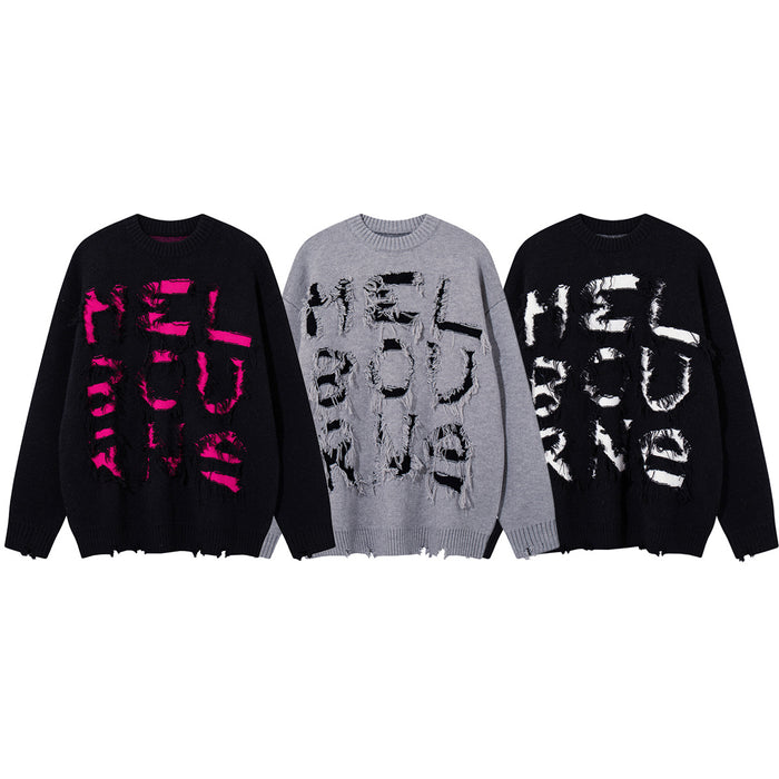 Three distressed knit crewneck sweaters in black with pink or white graphics and gray with black graphics