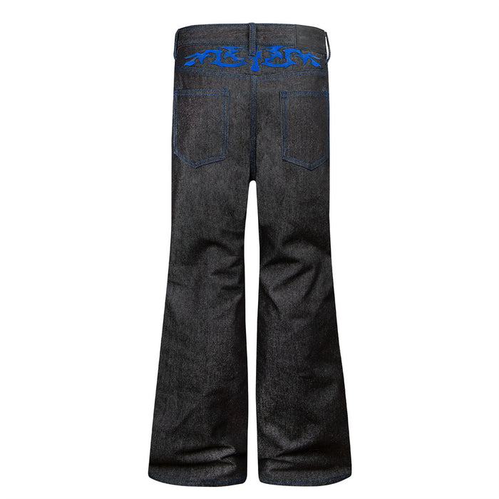 Back view of black bootcut jeans with blue stitching, belt loops, and rear pockets