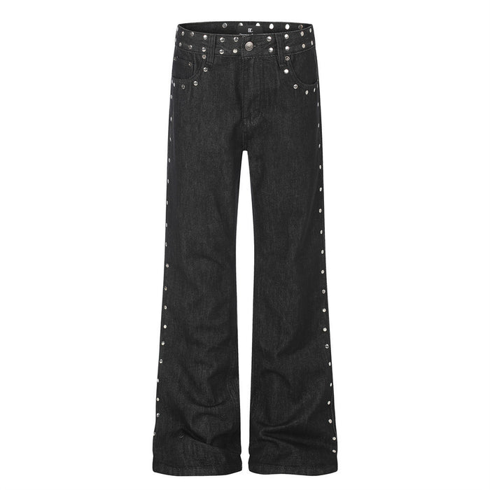 Front view of black bootcut jeans with silver studs along the waistband, pockets, and outer legs