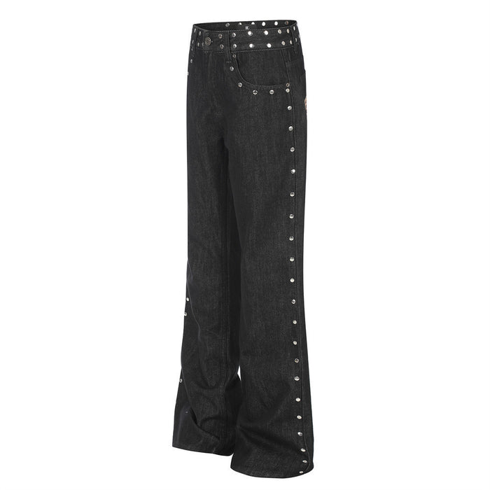 Three-quarter front view of black bootcut jeans showing the flared legs and studded outer seam