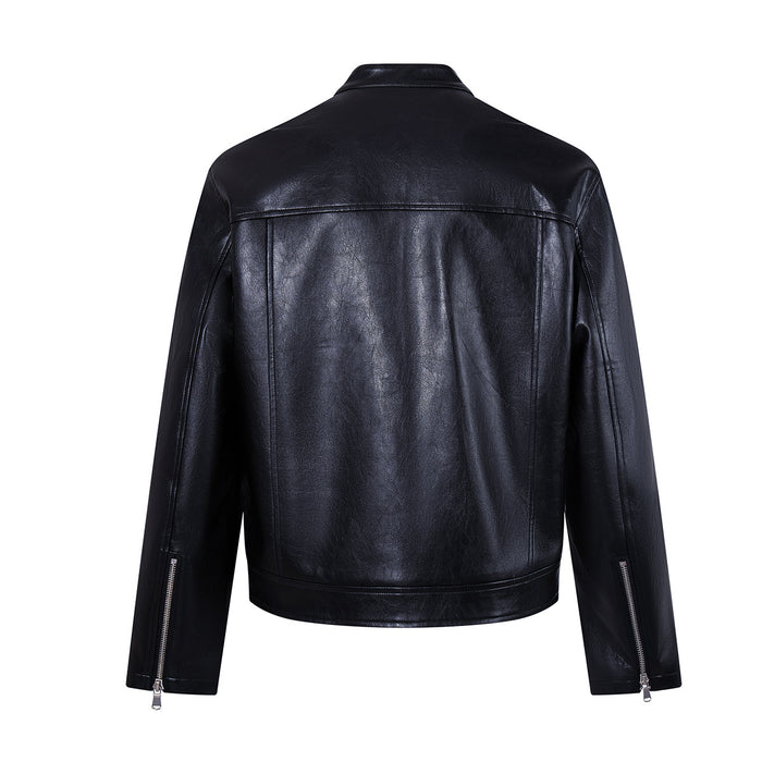 Back view of a black faux leather moto jacket showing the yoke seam, long sleeves, and zippered cuffs