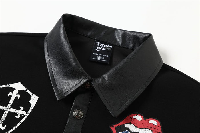 Close-up of black polo shirt collar, button placket, neck label and partial chest graphics