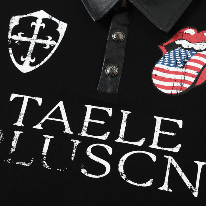 Close-up of black polo shirt front showing metal buttons, white shield emblem, distressed lettering and flag tongue graphic