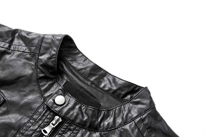 Close-up of the black jacket stand collar with snap button, stitching, and central metal zipper