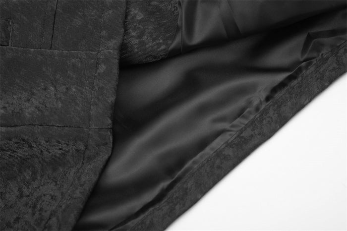 Close-up of the black moto jacket interior showing its smooth dark lining and finished hem