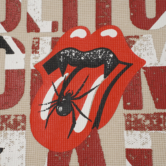 Detailed view of a red lips graphic with black tongue, white highlights, and a black spider over distressed lettering