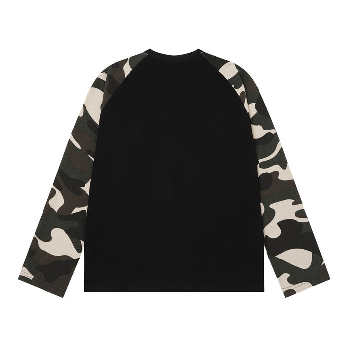 Back view of a black waffle-knit raglan shirt with full-length camouflage sleeves