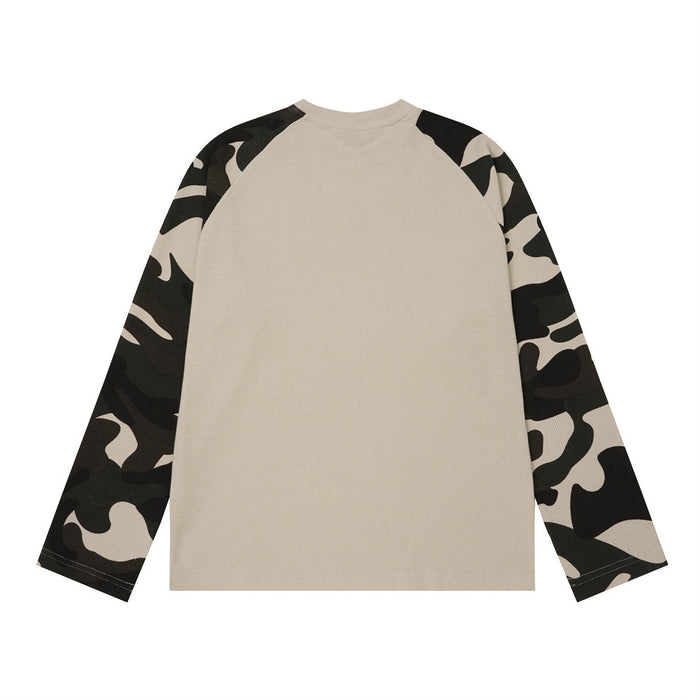 Back view of a beige waffle-knit raglan shirt with contrasting camouflage sleeves