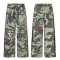 Camo wide-leg sweatpants shown front and back with navy side stripes, emblem patch, and number 2 detail