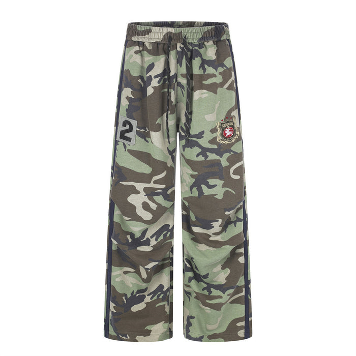 Men's wide-leg woodland camo sweatpants with navy side stripe and Karukawa emblem patch, front and back view