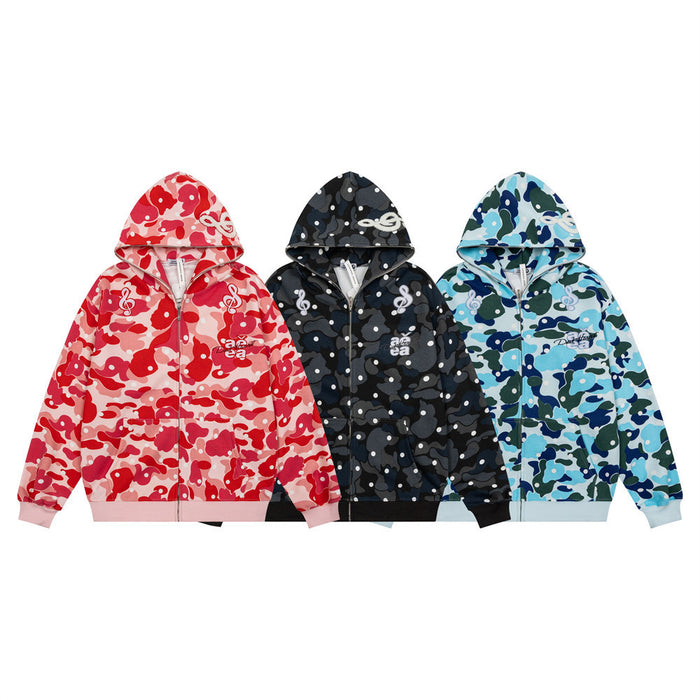 Three camo zip-up hoodies in red, black, and blue with hooded fronts and music note embroidery